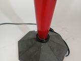 an image of a red table lamp with a black base
