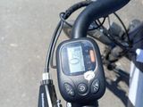 a close up of a bicycle with a gps device on it ' s handlebar