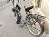 a bike that is parked on the side of the street