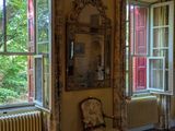 an image of a living room with two windows and a rug
