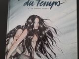 la couverture d'une bande dessinée représentant une femme assise par terre