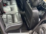 the interior of a car with leather seats and a steering wheel