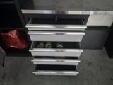 a drawer that has a bunch of items inside of it