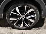a close up view of a car ' s wheel on the ground