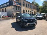 a black suv parked in front of a building