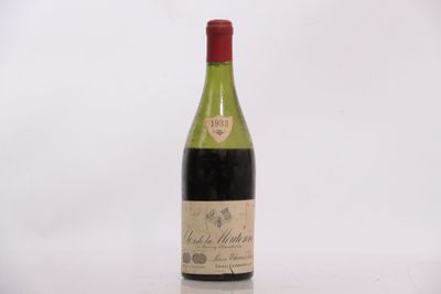 a bottle of wine that is sitting on a table