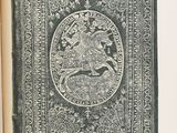 an old book with a picture of a man riding a horse on it