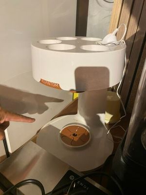 a person pointing at a piece of paper on a table