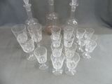 a lot of empty wine glasses and a bottle on the table