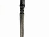 a close up of a metal pen with a red tip