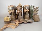 many different types of gas masks on a table