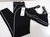 the leggings are black and white with a white stripe
