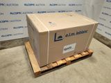 a cardboard box sitting on a pallet in front of a wall