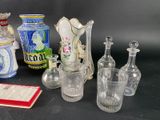 a lot of glass vases that are sitting on a table