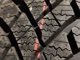 a close up of a tire with a red line on it