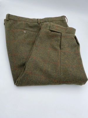 wool trousers with a brown and red check pattern on the bottom