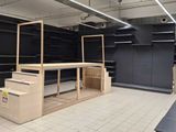 a large empty store with a lot of empty shelves