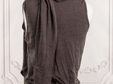 a close up of a mannequin torso with a brown shirt on it