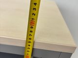measuring the height of a cabinet door with a tape measure