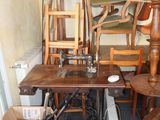 many chairs and a table in a room with a television