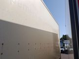 a large truck that is parked next to a building