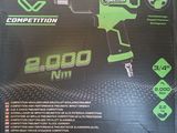 a box with a green and black power drill in it