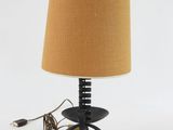 an image of a table lamp with a brown shade on it