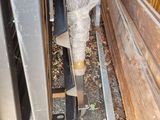 a wooden fence behind the door of a house