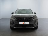 the front view of a grey car in a white room