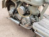 a close up of a motorcycle parked on the side of the road