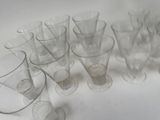 a lot of empty glasses on the table