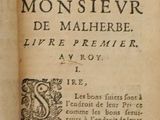 someone is holding a book with a picture of a monster on it