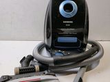 a vacuum that is sitting on a table next to a cord