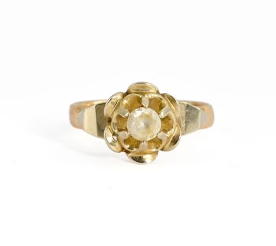 a close up of a gold ring with a flower on it