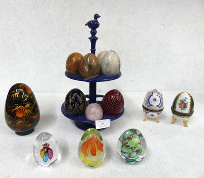 a lot of glass eggs on a stand on a table