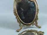 a small mirror and a small mirror on a table