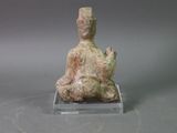 an image of a statue of a person sitting in a lotus position