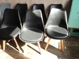 four chairs that are lined up in a row