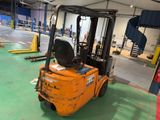 a fork lift truck parked inside of a warehouse