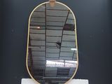 a mirror that is sitting on top of a table
