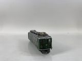 a toy train on a white surface with a white background