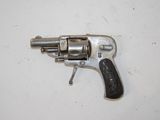 a close up of a revolver on a table with a white background