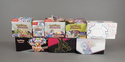 many different types of pokemon trading cards in the box
