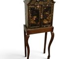 an image of a small cabinet on a stand on a white background