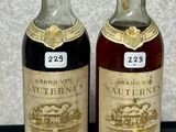 two bottles of wine sitting next to each other on a table