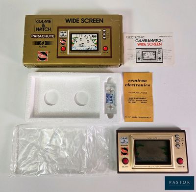 an image of a game console and other electronic items on a white surface