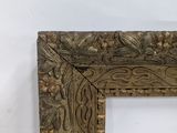an old picture frame with a decorative pattern on it