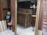 a mirror that is sitting on the floor in a room