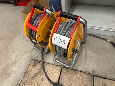 two cable reels that are connected to the ground