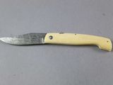 a knife that is laying on a table